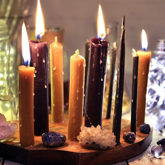 A mystical Ostara scene with lit candles, crystals, and a wooden base, evoking a spiritual and gothic atmosphere.
