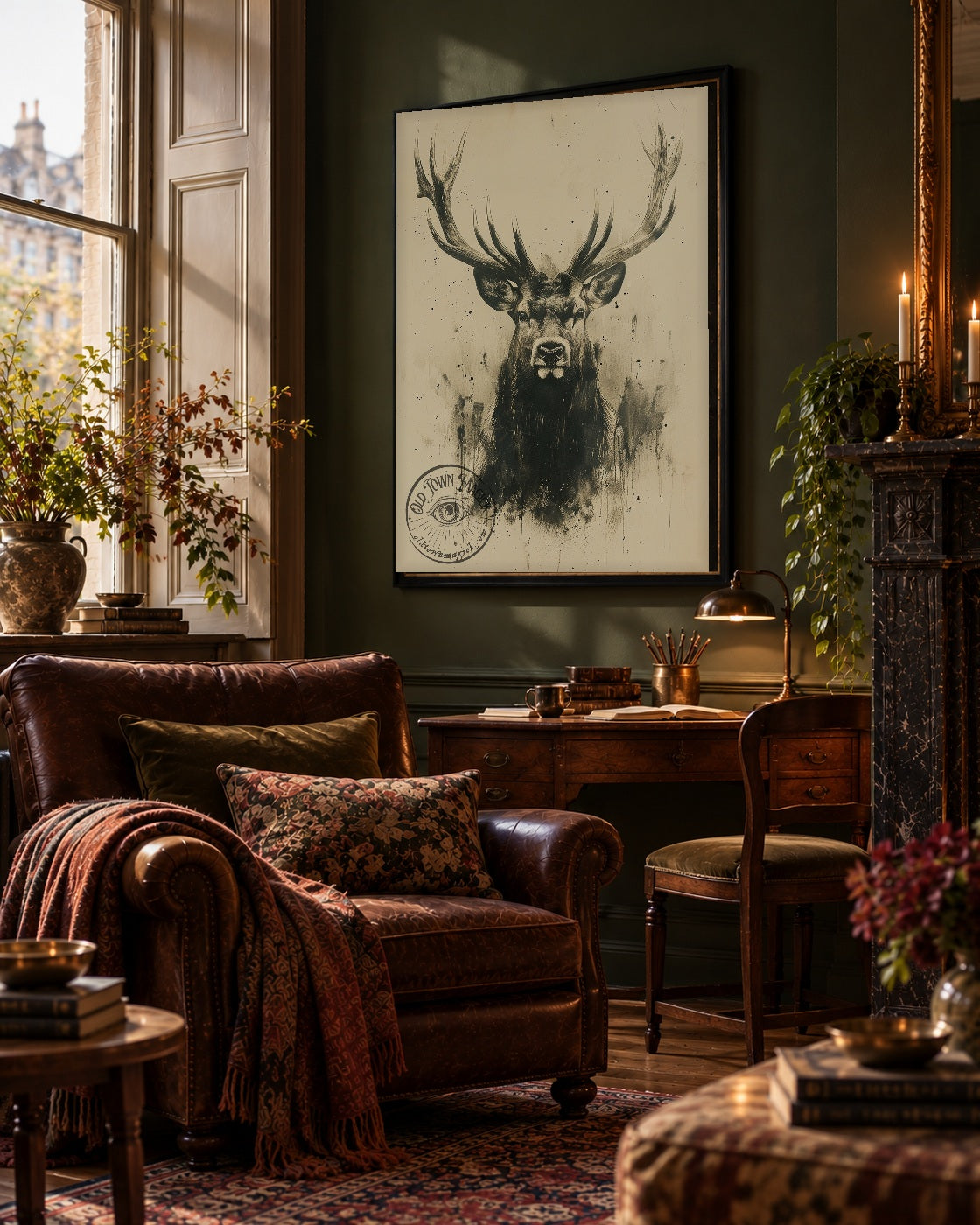 Vintage Scottish stag portrait wall art in a black frame above an antique writing desk in a dark olive Edinburgh Georgian study with leather armchair and sash window.